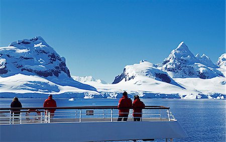 simsearch:862-03288559,k - Passengers on the stern of the MV Discovery and cruising along Graham Land and the Antarctic Penisula. Antarctica Stock Photo - Rights-Managed, Code: 862-03288465