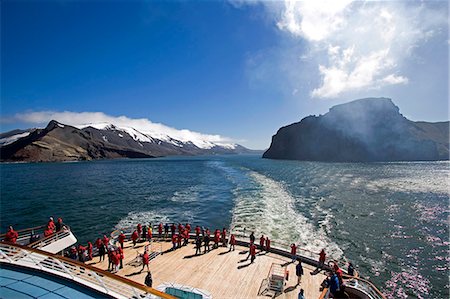 deception island - The cruise ship the MS Discovery overlooking the narrow passage through Neptune Bellows the entry into the collapse caldera that forms the centre of Deception Island on the Antarctic Peninsula with the stern of the ship,its passenger and Jacuzzi area visible. Stock Photo - Rights-Managed, Code: 862-03288469