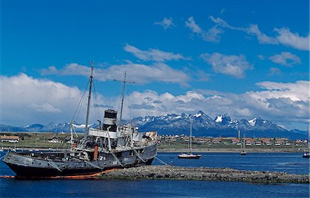 shipwreck - Argentina,Tierra del Fuego,Ushuaia. Wreck of the tug Saint Christopher with Beagle Channel and Tierra del Fuego in background. Stock Photo - Rights-Managed, Code: 862-03288620