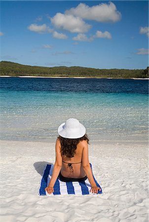 simsearch:862-03808798,k - A woman looks out over the clear waters and white sand beach of Lake McKenzie on Fraser Island. Stock Photo - Rights-Managed, Code: 862-03288693