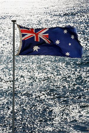 The Australian flag flutters in the breeze with a backdrop of the Pacific at Bondi Beach Stock Photo - Rights-Managed, Code: 862-03288787
