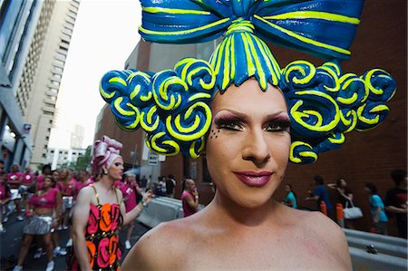 face of carnival - Participants in elaborate dress arrive for the annual Gay and Lesbian Mardi Gras on Oxford Street in Sydney Stock Photo - Rights-Managed, Code: 862-03288894