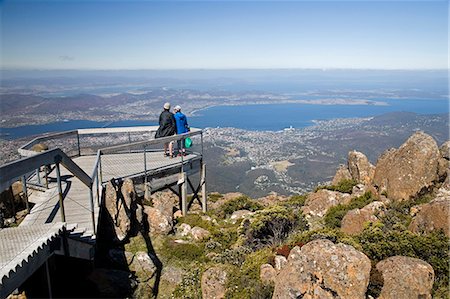 simsearch:862-03288987,k - Tourists take in the spectaular view of Hobart from the top of Mount Wellington at 1271m. Stock Photo - Rights-Managed, Code: 862-03288916