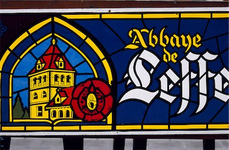 A stained glass window advertises a Belgian beer. Stock Photo - Rights-Managed, Code: 862-03289378