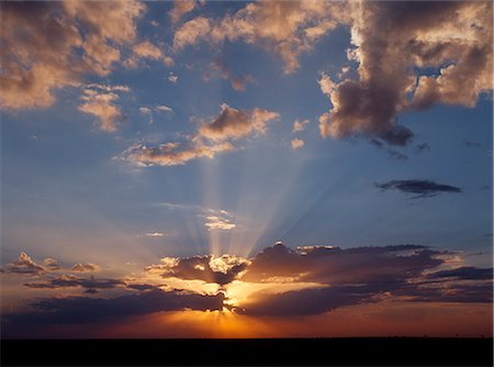 Sunset over the featureless Ntwetwe salt pan. Ntwetwe is the western of two huge saltpans,which comprise the immense Makgadikgadi region of the Northern Kalahari one of the largest expanses of saltpans in the world. Stock Photo - Rights-Managed, Code: 862-03289583