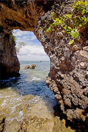 simsearch:862-03289687,k - Brazil,Bahia,Barra Grande,Ilha da Pedra Furada (holed stone Island). The sea arch from which the island gets it name at low tide. Stock Photo - Rights-Managed, Code: 862-03289795