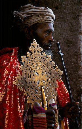 priest ethiopia - A priest holds a pair of the monastery's many ancient crosses. Stock Photo - Rights-Managed, Code: 862-03354018