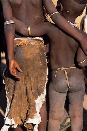 Two Karo children stand together,arm in arm. A small Omotic tribe related to the Hamar,who live along the banks of the Omo River in southwestern Ethiopia,the Karo are renowned for their elaborate body painting using white chalk,crushed rock and other natural pigments. Stock Photo - Rights-Managed, Code: 862-03354038