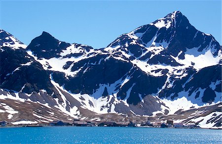 Abandoned whaling station with mountains behind. Stock Photo - Rights-Managed, Code: 862-03354147