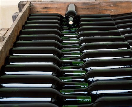 Bottles of Vina Hermosa Reserva 2001 lie in a crate ready for labelling in the wine cellar at the family owned Vina Hermosa winery. 2001 is deemed to have been one of the best years in the history of Rioja wine. Foto de stock - Con derechos protegidos, Código: 862-03354325