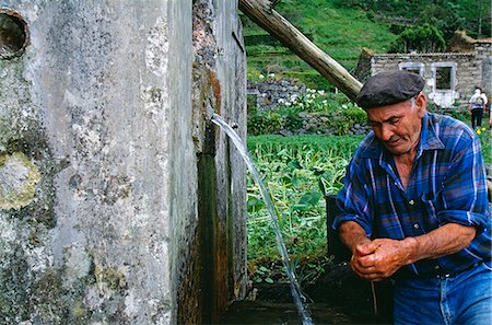 sao miguel - A local farmer pauses to wash his hands at a natural spring at Sanguinho on the island of Sao Miguel,Azores Stock Photo - Rights-Managed, Code: 862-03354430