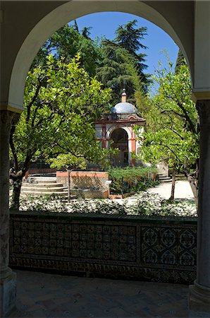 real alcazar - View of an elegant domed building in the gardens of the Real Alcazar Palace,Seville,Spain Stock Photo - Rights-Managed, Code: 862-03354503