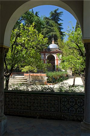 spanish courtyards photos - View of an elegant domed building in the gardens of the Real Alcazar Palace,Seville,Spain Stock Photo - Rights-Managed, Code: 862-03354503