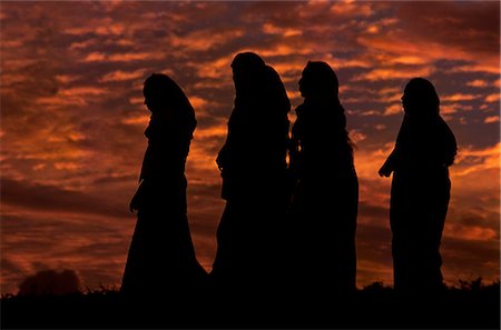 Women stroll around the fort walls at sunset. Stock Photo - Rights-Managed, Code: 862-03354550