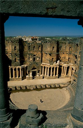 simsearch:862-03354820,k - Originally built by the Romans,Bosra's 15,000 seat amphitheatre was gradually fortified from the 7th century on by successive Arab dynasties; it remains among the best preserved Roman theatres. Stock Photo - Rights-Managed, Code: 862-03354769