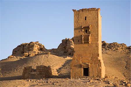 ruined city - The Towers of Yemliko at Palmyra,Syria. The city was at its height in the 3rd century AD but fell into decline when the Romans captured Queen Zenobia after she declared independence from Rome in 271. Stock Photo - Rights-Managed, Code: 862-03354866