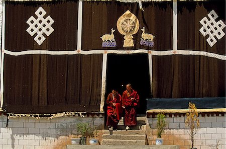 Tibet,Sanga Monastery. Monks leave the main Assembly Hall of this small monastery near Lhasa. Stock Photo - Rights-Managed, Code: 862-03355005