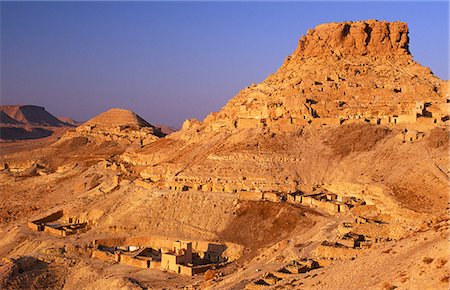 photo of mosque tunisia - Clinging to a ridge of the Jebel Haouaia,the ruined and mostly abandoned Berber village of Chenini is one of southern Tunisia's most evocative sights Stock Photo - Rights-Managed, Code: 862-03355023