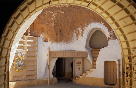 Tunisia,Matmata. Converted from one of the town's celebrated troglodyte pit-homes,the Sidi Driss Hotel still retains parts of the Star Wars film sets. Stock Photo - Rights-Managed, Code: 862-03355030