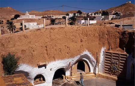Tunisia,Matmata. Converted from one of the town's celebrated troglodyte pit-homes,the Sidi Driss Hotel still retains parts of the Star Wars film sets. Fotografie stock - Rights-Managed, Codice: 862-03355032