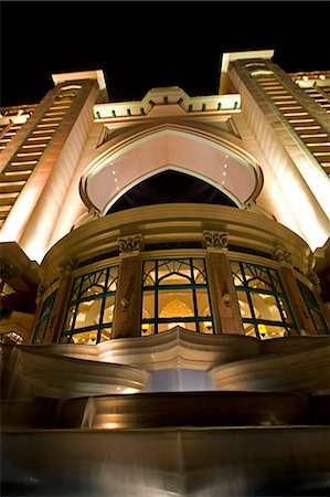 simsearch:862-08091516,k - United Arab Emirates,Dubai,The Atlantis Palm Hotel. The main facade of the hotel illuminated at night Stock Photo - Rights-Managed, Code: 862-03355362