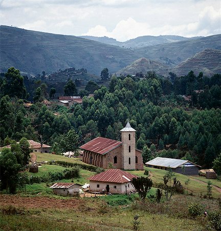 simsearch:862-03354008,k - The Catholic church at Nyaruhanga is of an unmistakable Italian style. It was built by Italian missionaries during the last century. Most foreign missionaries left the country during Idi Amin's reign of terror in the 1970's. Stock Photo - Rights-Managed, Code: 862-03355417