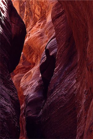 erosion gully - A slot canyon. these canyons are carved out by small rivers that often lie dry,but are prone to flash flood. The waters can rise from inches to 60 feet in under an hour making them extremely dangerous. Stock Photo - Rights-Managed, Code: 862-03355522