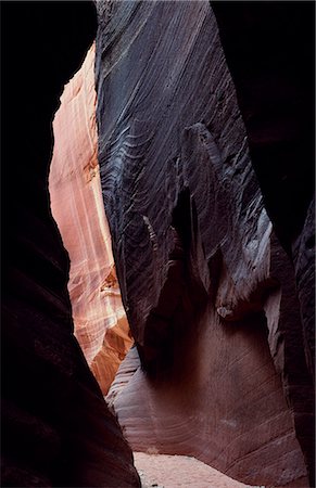 erosion gully - A slot canyon. these canyons are carved out by small rivers that often lie dry,but are prone to flash flood. The waters can rise from inches to 60 feet in under an hour making them extremely dangerous. Stock Photo - Rights-Managed, Code: 862-03355523