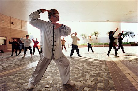 foreshore - A group perform T'ai chi near the Kowloon waterfront at Tsim Sha Tsui Stock Photo - Rights-Managed, Code: 862-03350972