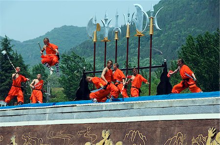 Kung Fu students displaying their skills at a tourist show within Shaolin Temple,Henan Province,China. Shaolin is the birthplace of Kung Fu martial art. Stock Photo - Rights-Managed, Code: 862-03351075