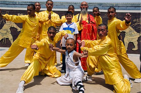 shaolin monastery - Kung Fu students displaying their skills at a tourist show within Shaolin Temple,Henan Province,China. Shaolin is the birthplace of Kung Fu martial art. Stock Photo - Rights-Managed, Code: 862-03351076