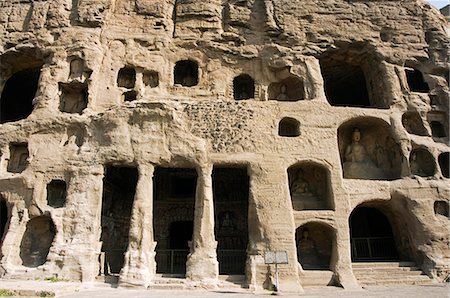 China,Shanxi Province,Datong. Yungang Caves containing buddhist statues cut during the Northern Wei Dynasty (460 AD). Unesco World Heritage site near Datong. Stock Photo - Rights-Managed, Code: 862-03351163