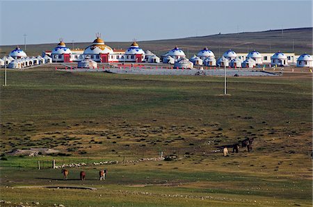 China,Inner Mongolia Province,Xilamuren Grasslands. Horses and nomad yurt tents in the distance. Stock Photo - Rights-Managed, Code: 862-03351174