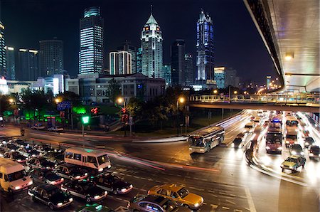 people's square - China,Shanghai,Huangpu District. People's Square - car light trails and illuminated buildings. Foto de stock - Con derechos protegidos, Código: 862-03351245