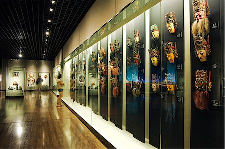 China,Shanghai,Shanghai Museum. Chinese Minority Nationalities Art Gallery - colour lacquered wooden masks for Di Xi. Stock Photo - Rights-Managed, Code: 862-03351250