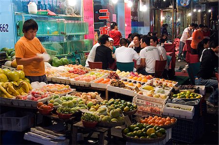 China,Shanghai. Outdoor fruit market and dining area. Stock Photo - Rights-Managed, Code: 862-03351260