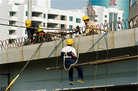 China,Beijing. Construction workers on a new highway. Stock Photo - Rights-Managed, Code: 862-03351329