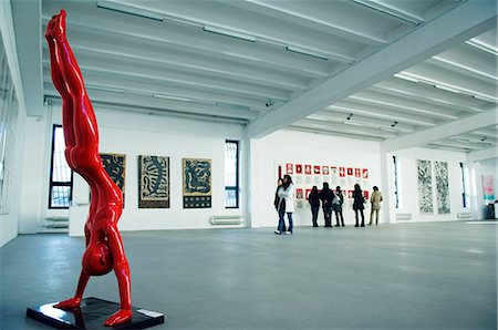 person inside of art gallery - China,Beijing. A gallery exhibition at Factory 798 Art district. Stock Photo - Rights-Managed, Code: 862-03351351