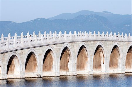 simsearch:862-03351726,k - China,Beijing. Summer Palace - Unesco World Heritage Site. A young girl on the 17 arch bridge . Stock Photo - Rights-Managed, Code: 862-03351450