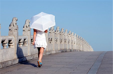 simsearch:862-03351693,k - China,Beijing. Summer Palace - Unesco World Heritage Site. A young girl on the 17 arch bridge . Stock Photo - Rights-Managed, Code: 862-03351451