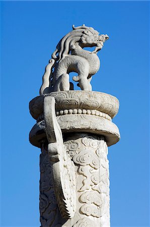 China,Beijing,Tiananmen Square. A dragon sitting on top of a huabiao statue. Stock Photo - Rights-Managed, Code: 862-03351489