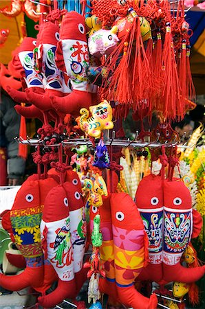 selling fish - China,Beijing. Chinese New Year Spring Festival - Fish decoration for sale at Ditan Park temple fair. Stock Photo - Rights-Managed, Code: 862-03351557