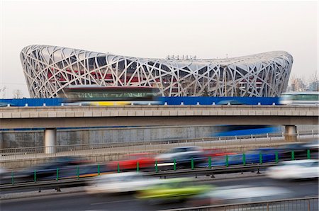 street highway - China,Beijing. The National Stadium,Olympic Green and blurred movement of cars on the higway. Stock Photo - Rights-Managed, Code: 862-03351618