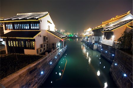 province - China,Jiangsu Province,Suzhou City. Shantang water town traditional old river side houses illuminated at night Stock Photo - Rights-Managed, Code: 862-03351662