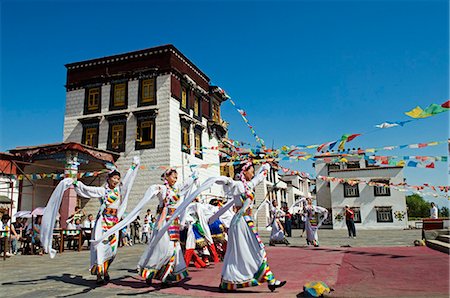 China,Beijing,Ethnic Minorities Park. Tibetan style temple and cultural dancers Stock Photo - Rights-Managed, Code: 862-03351798