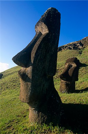 quarry - Chile,Easter Island. Moai head on a hillside at Rano Raraku,a site where many of the Moai were quarried out of the volcanic rock. Stock Photo - Rights-Managed, Code: 862-03352209