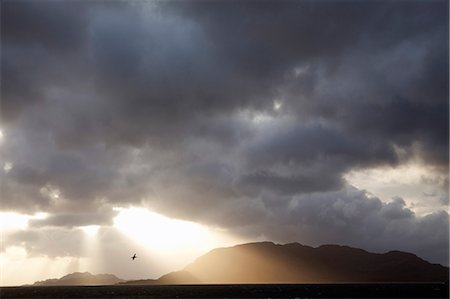 simsearch:862-03352073,k - Chile,Tierra del Fuego,Strait of Magellan. Storms and high winds have always made this crucially important seaway and interesting challenge for mariners but in fine weather dramatic skies and impressive sunsets are common. Foto de stock - Con derechos protegidos, Código: 862-03352347