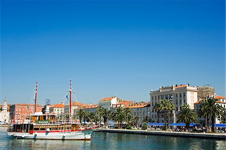 Split Waterfront Town Buildings and Harbour Sailing Ship Stock Photo - Rights-Managed, Code: 862-03352425