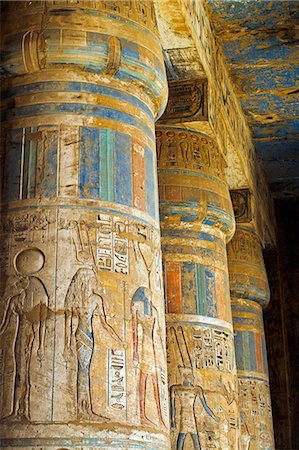 Painted sunken relief carving adorns columns in the mortuary temple of Ramses III on the West bank of the Nile at Luxor. Stock Photo - Rights-Managed, Code: 862-03352751