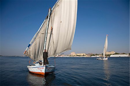 felucca - Felouques voile sur le Nil à Louxor, Égypte Photographie de stock - Rights-Managed, Code: 862-03352788